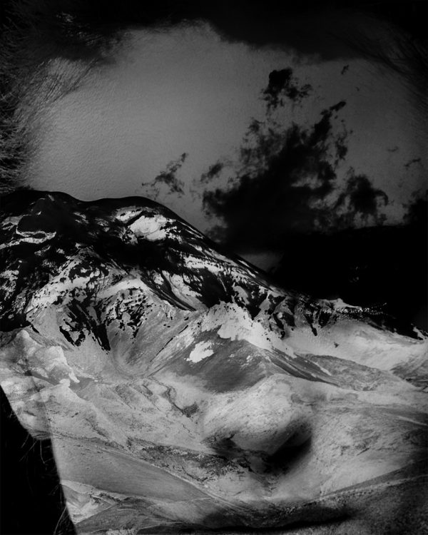 Close-up of woman's determined face blended with a mountain